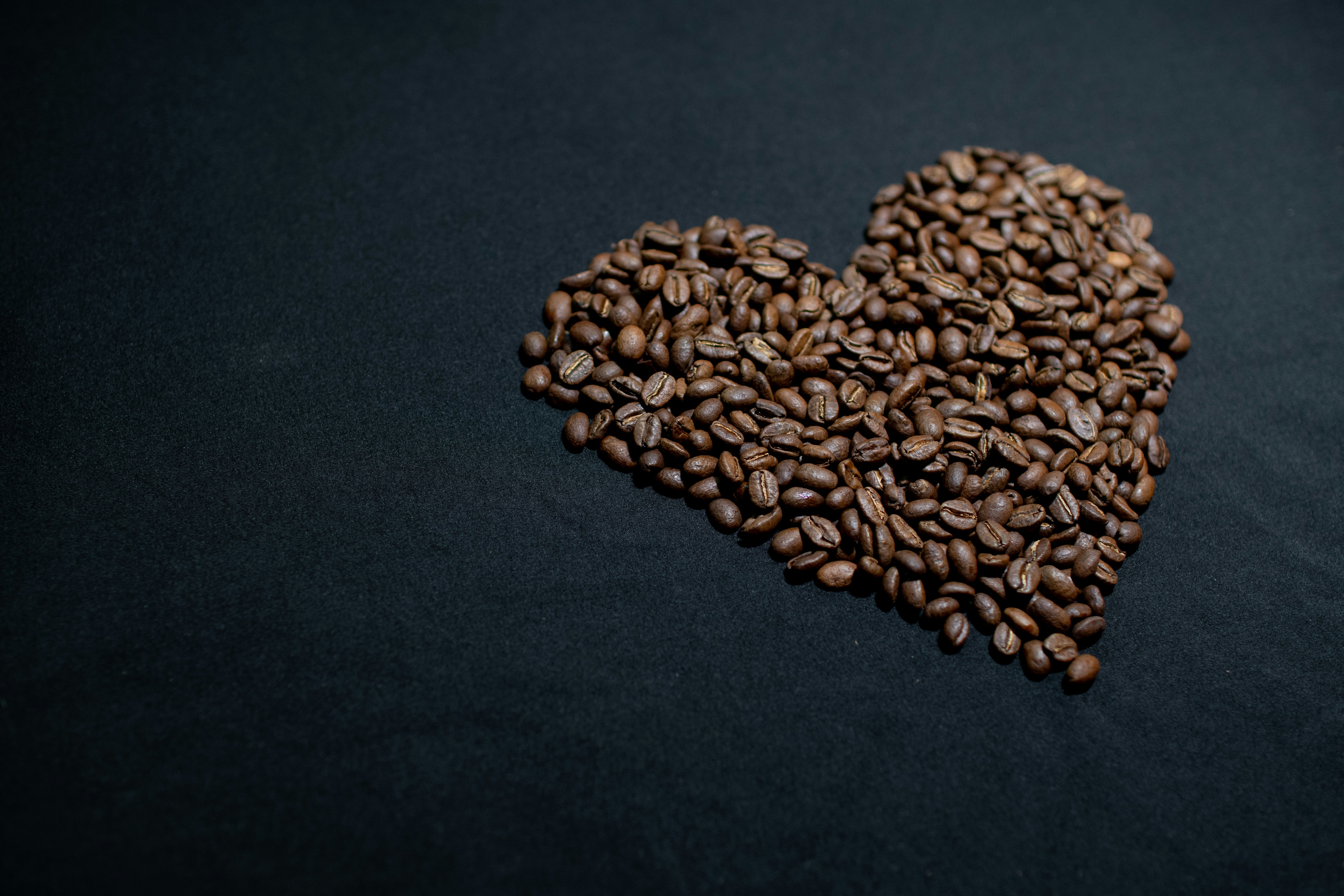brown coffee beans on black textile